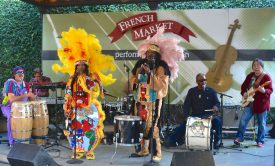 101 Runners, a funk ensemble that draws heavily on Mardi Gras Indian musical traditions, performing at the French Market stage in Dutch Alley in the lead-up to Mardi Gras 2015