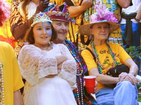 Queen Coleen, along with granddaughter Catherine Salley and friend Sue Turner, watching observing her royal subjects in her French Quarter courtyard on Mardi Gras. 