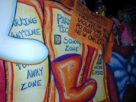 Satirical float in the 2002 Knights of Chaos parade depicting parking violations and boots.