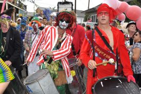 Drummers in costume marching in the Society of Saint Anne parade on Mardi Gras 2011