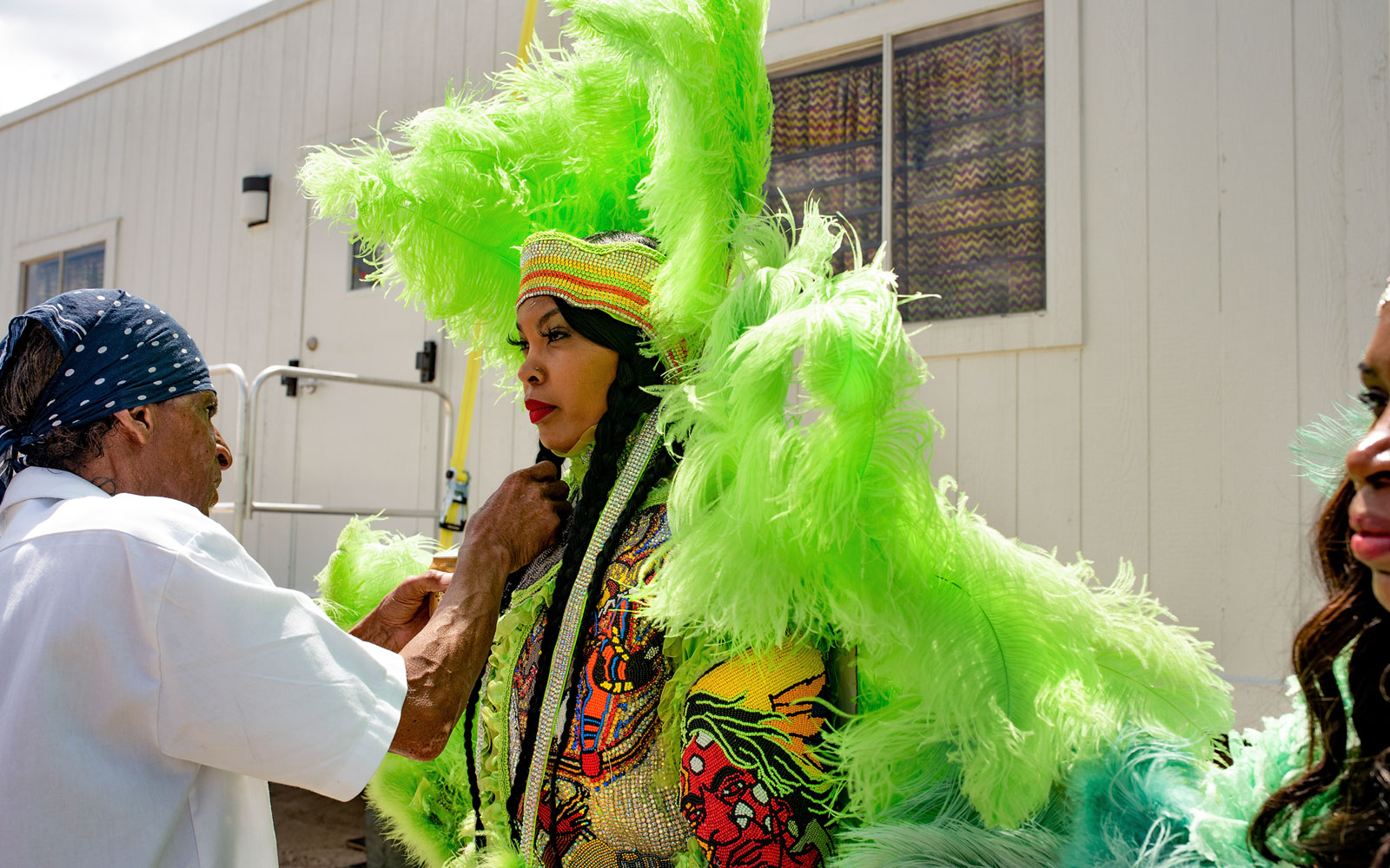 Big Chief Lil Walter Cook of the Creole Wild West helping Queen Melissa 