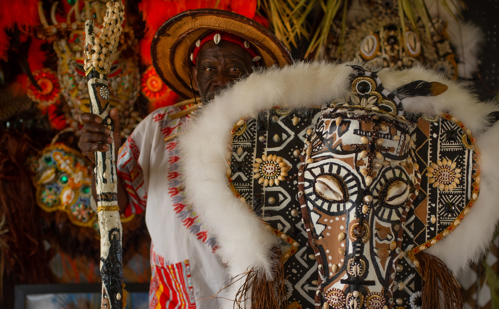 Big Chief Victor Harris of Fi Yi Yi - Mandingo Warriors with regalia in the Louisiana Folklife Village at the 2022 New Orleans Jazz and Heritage Festival